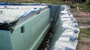 Extruded board for basement enclosure